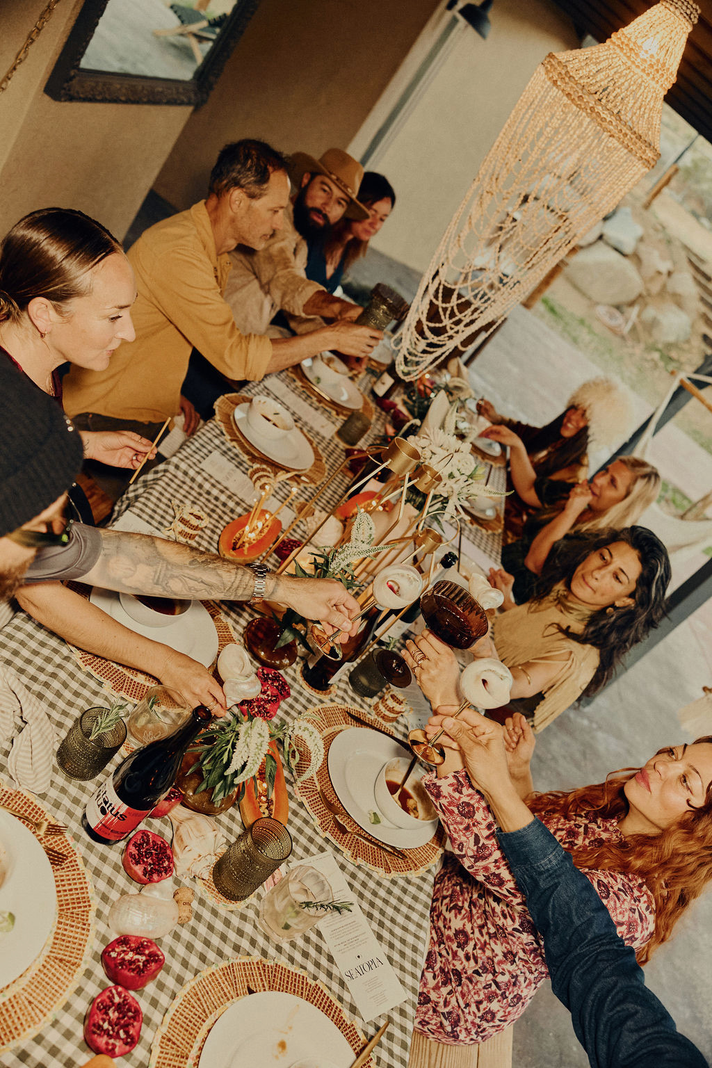 Guests raising glasses around a long Hill Country table